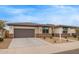 A cozy single-story house with a two-car garage and a well-maintained desert landscape at 39758 N Hailey Ln, Queen Creek, AZ 85140