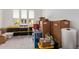 Storage room with packed boxes and plastic storage containers at 39758 N Hailey Ln, Queen Creek, AZ 85140