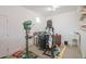 An organized workshop with multiple tools, including a drill press, band saw, and a utility sink at 39758 N Hailey Ln, Queen Creek, AZ 85140