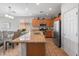 Bright, open kitchen area with stainless appliances, granite countertops, and tile flooring at 41105 N Prestancia Way, Anthem, AZ 85086