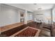 Spacious living room featuring an open layout, hardwood floors, and ample natural light, ideal for relaxation and entertaining at 41105 N Prestancia Way, Anthem, AZ 85086