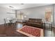 Inviting living and dining area with hard wood floors at 41105 N Prestancia Way, Anthem, AZ 85086