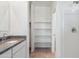 Bathroom with granite countertop and open shelving for storage in the shower at 5123 E Umber Rd, San Tan Valley, AZ 85143