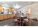 Combined kitchen and dining area with wooden cabinets, stainless steel fridge, and seating at 520 N Ocotillo Dr, Apache Junction, AZ 85120