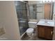 Updated bathroom features a glass-enclosed shower, and modern fixtures at 5518 E Lindstrom Ln # 1034, Mesa, AZ 85215