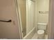 Well-lit bathroom with a shower-tub combination and a standard white toilet at 5518 E Lindstrom Ln # 1034, Mesa, AZ 85215