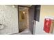 Unit entryway featuring textured walls and access to the carpeted living areas at 5518 E Lindstrom Ln # 1034, Mesa, AZ 85215