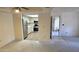 Open-concept living space flows into a modern kitchen with stainless steel appliances at 5518 E Lindstrom Ln # 1034, Mesa, AZ 85215