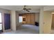 Bright living room with carpet, ceiling fan, and a built in Murphy bed with storage at 5518 E Lindstrom Ln # 1034, Mesa, AZ 85215
