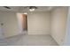 Spacious living room offers neutral carpeting and easy access to other rooms at 5518 E Lindstrom Ln # 1034, Mesa, AZ 85215