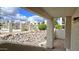 Charming patio overlooking a community pool area with lush landscaping at 5518 E Lindstrom Ln # 1034, Mesa, AZ 85215