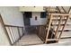 Community staircase with railing leading to the second-floor units at 5518 E Lindstrom Ln # 1034, Mesa, AZ 85215