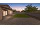 Expansive backyard featuring a well-maintained lawn, covered patio, and block fence at 5819 S 10Th St, Phoenix, AZ 85040