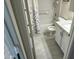 Bathroom features a tub with shower, a toilet, and a vanity with granite counters and white cabinets at 5819 S 10Th St, Phoenix, AZ 85040