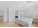 Serene bedroom with wood floors and ensuite bathroom access at 5819 S 10Th St, Phoenix, AZ 85040