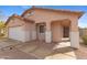 Inviting front entrance with charming architectural details and low-maintenance landscaping at 5819 S 10Th St, Phoenix, AZ 85040