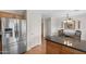 Updated kitchen with stainless steel refrigerator and eat-in dining area at 5819 S 10Th St, Phoenix, AZ 85040