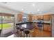 Well-equipped kitchen with breakfast bar, stainless appliances, and backyard access at 5819 S 10Th St, Phoenix, AZ 85040