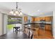 Eat-in kitchen features stainless appliances, granite counters, and backyard access at 5819 S 10Th St, Phoenix, AZ 85040