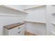 Organized walk-in closet with built-in shelving and drawers maximizing storage space and functionality at 5819 S 10Th St, Phoenix, AZ 85040