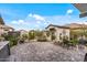 Well-maintained backyard with charming shed, manicured landscaping, and cozy seating area for outdoor enjoyment at 5831 N 196Th Ln, Litchfield Park, AZ 85340
