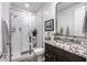 Modern bathroom with glass shower, granite countertop, undermount sink and modern hardware fixtures at 5831 N 196Th Ln, Litchfield Park, AZ 85340