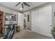 Comfortable carpeted bedroom with closet and desk. A ceiling fan provides added comfort at 5831 N 196Th Ln, Litchfield Park, AZ 85340