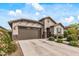 Charming single-story home with well-manicured landscaping and a two-car garage at 5831 N 196Th Ln, Litchfield Park, AZ 85340