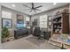 Functional home office with a ceiling fan, natural light, and ample workspace and storage at 5831 N 196Th Ln, Litchfield Park, AZ 85340