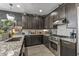 Modern kitchen featuring sleek appliances and ample cabinet space at 5831 N 196Th Ln, Litchfield Park, AZ 85340