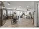 Open floor plan showing kitchen, dining, and bedroom areas with coordinated decor at 5831 N 196Th Ln, Litchfield Park, AZ 85340