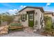Quaint backyard shed featuring a green door, decorative wreath, and charming curb appeal at 5831 N 196Th Ln, Litchfield Park, AZ 85340