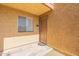 Exterior entryway with covered porch, desert landscaping, and unit number 1145 at 5877 N Granite Reef Rd # 1145, Scottsdale, AZ 85250