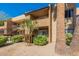 Building exterior with second story patios, green landscaping, and desert-friendly ground cover at 5877 N Granite Reef Rd # 1145, Scottsdale, AZ 85250