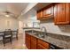 The open kitchen is adjacent to the dining area, fostering a seamless flow and connectivity at 5877 N Granite Reef Rd # 1145, Scottsdale, AZ 85250