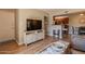 Living area showcasing breakfast bar, wood floors, and neutral decor at 5877 N Granite Reef Rd # 1145, Scottsdale, AZ 85250
