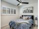 Comfortable bedroom with shutters, ceiling fan, and modern decor art at 6326 N 86Th N St, Scottsdale, AZ 85250