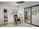 Well-lit office space with glass desk, mirrored closet, and modern design at 6326 N 86Th N St, Scottsdale, AZ 85250