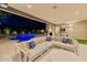 Outdoor space featuring a pool and inviting patio with lounge furniture and a built in grill at 7278 E Echo Ln, Scottsdale, AZ 85258