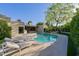 Beautiful backyard featuring a pool, outdoor lounge furniture, lush landscaping and a built in BBQ at 7278 E Echo Ln, Scottsdale, AZ 85258