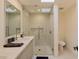 Modern bathroom featuring a glass shower with a skylight, sleek fixtures, and a bright, minimalist design at 7278 E Echo Ln, Scottsdale, AZ 85258