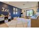 Playful ' room featuring a blue accent wall, cozy rug, and creative play area with plenty of toys at 7278 E Echo Ln, Scottsdale, AZ 85258