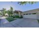 Inviting single-story home featuring a two-car garage, desert landscaping, and tile roof at 7278 E Echo Ln, Scottsdale, AZ 85258