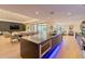 Open concept kitchen featuring a large island, modern appliances, and seamless flow into the living and dining areas at 7278 E Echo Ln, Scottsdale, AZ 85258