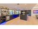 Modern kitchen with a large island, sleek cabinets, and stainless steel appliances at 7278 E Echo Ln, Scottsdale, AZ 85258