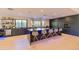 Modern kitchen with sleek dark cabinetry, a large island with seating, and a wine fridge for elegant entertaining at 7278 E Echo Ln, Scottsdale, AZ 85258