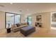 Spacious living room featuring sliding glass doors to the outside and a fireplace at 7278 E Echo Ln, Scottsdale, AZ 85258