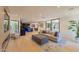 Bright, open-concept living room with modern furnishings and seamless flow to the kitchen at 7278 E Echo Ln, Scottsdale, AZ 85258