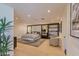 Spacious bedroom with a luxurious bed, chairs and great natural light at 7278 E Echo Ln, Scottsdale, AZ 85258