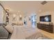 Inviting bedroom showcasing a cozy king-size bed, dresser and an access to a private patio at 7278 E Echo Ln, Scottsdale, AZ 85258